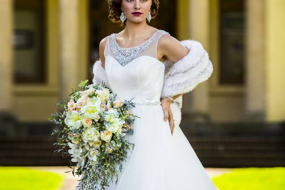 Bride in front of lord mansion