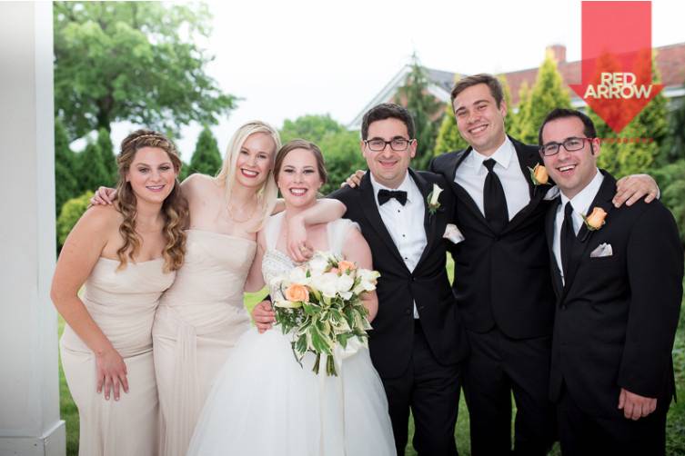 The couple with the bridesmaids and groomsmen