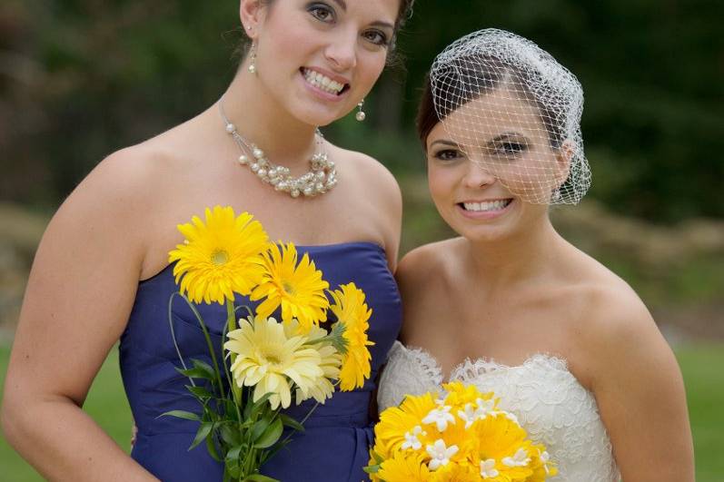 Bride and bridesmaid with flowers