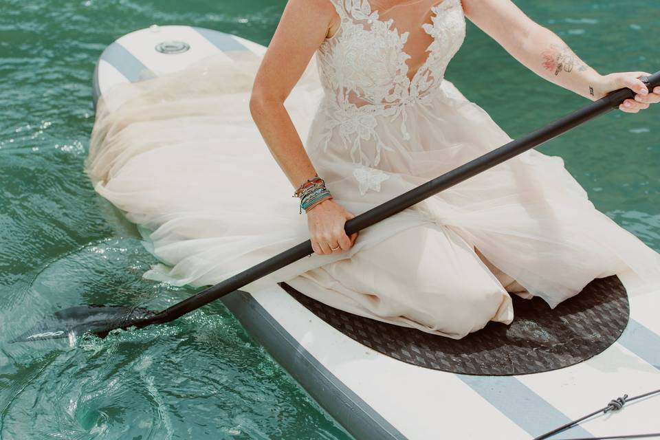 Paddle boarding bride
