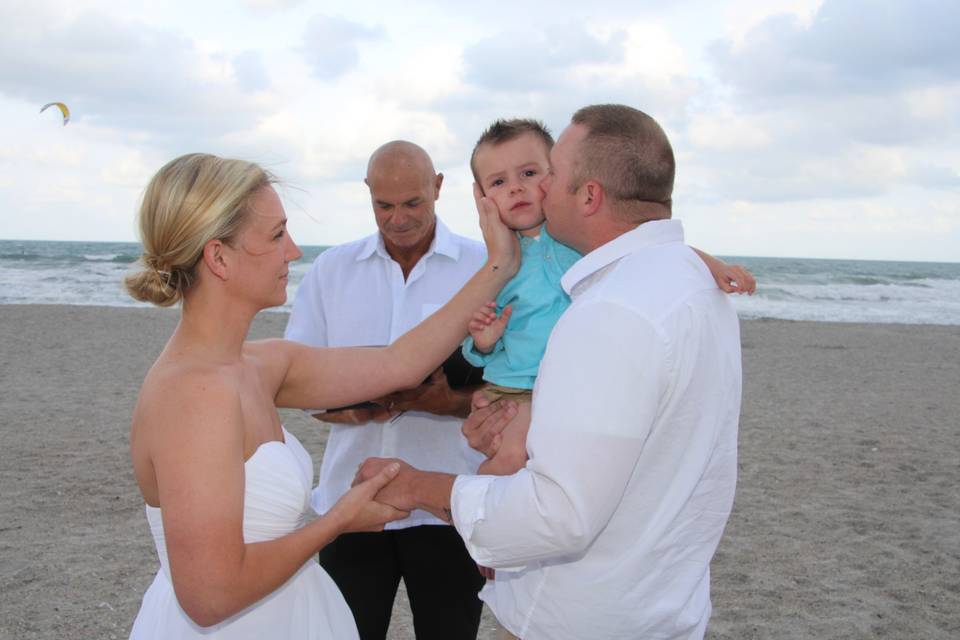 Www.CocoaBeachWeddings.com                         tender moments during a ceremony.  Officiant Dave Salisbury.