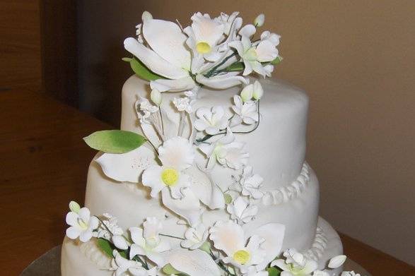 3 tier cake with fondant and cascading flowers