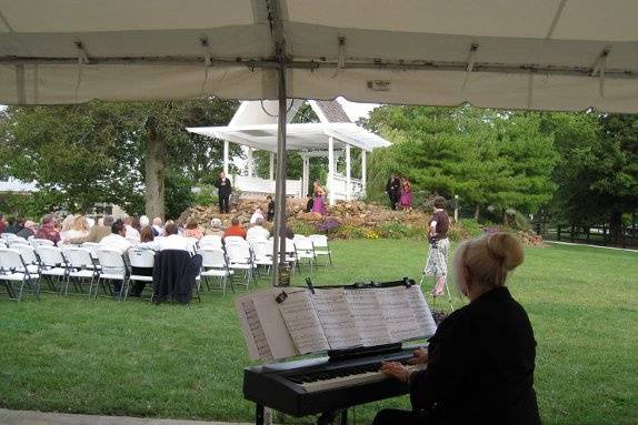 Phyllis Lynch on Piano Keyboard at Lumiere du Spa, Lebanon IN, outdoor wedding.