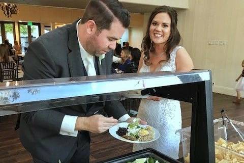 Bride and Groom enjoying their first meal