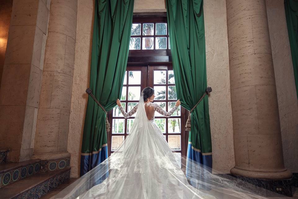 Bride peering out the window