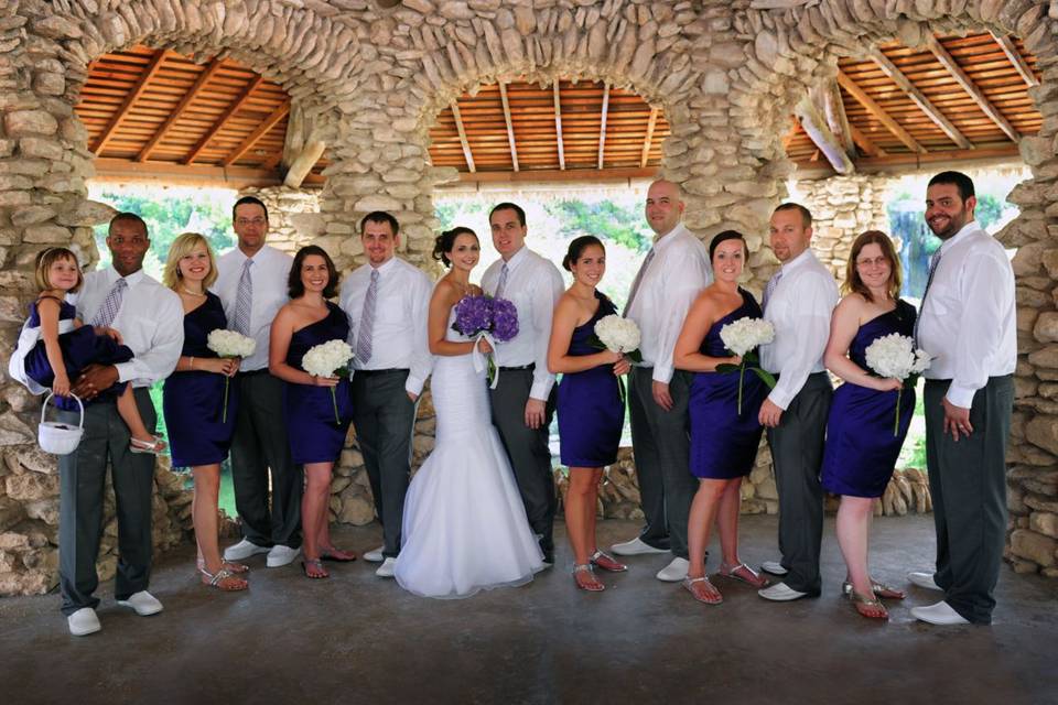 The couple with the bridesmaids and groomsmen