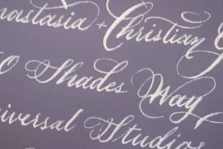 White calligraphy on black pap