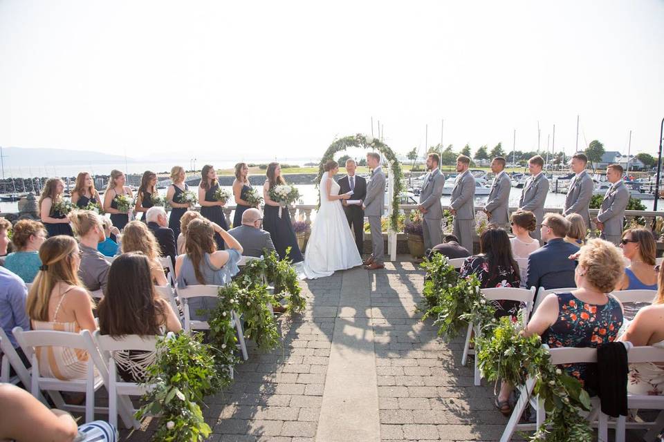 Scenic ceremony by the harbor