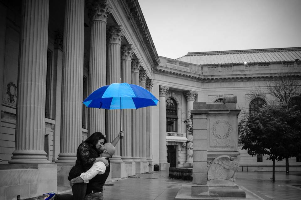 Couple embracing in the rain - Russell's Photography Studio