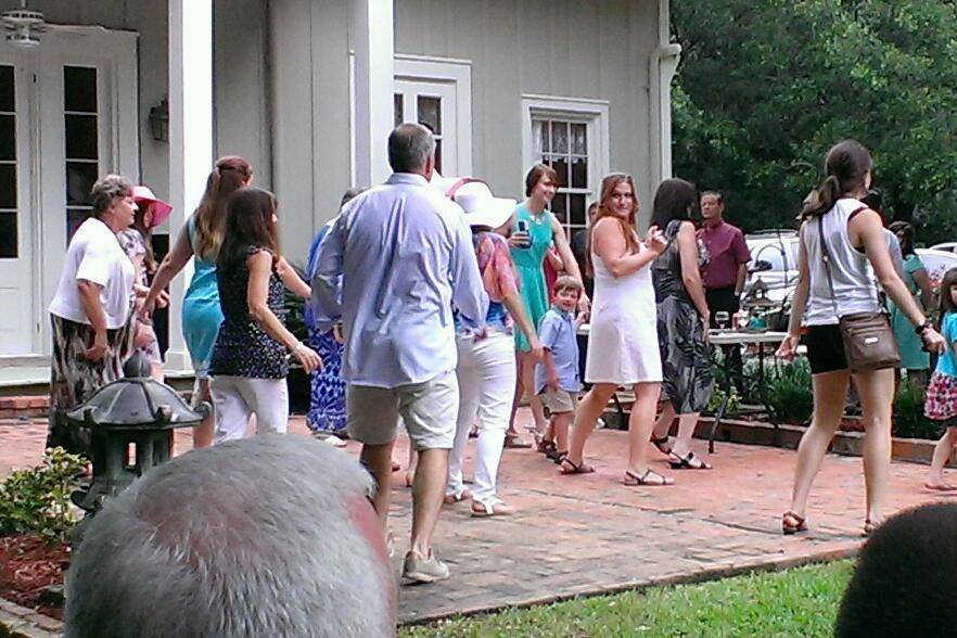 When it rains on your wedding day, our bride danced in the rain until everyone else joined in... Great way to make a wet day better.