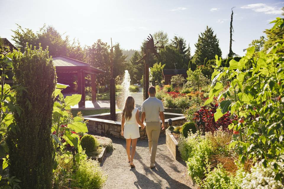 Couple walking in gardens