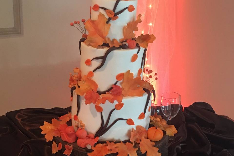 A fall beauty!  Even the bottom layer is a cake tier made to look like a tree trunk.