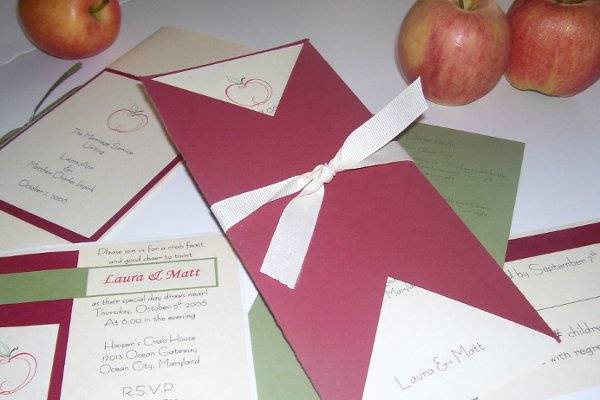 Turning Leaf
Perfect for Fall, and almost as beautiful, the Turning Leaf will leave your guests stunned with the amount of details captured in this invitation.   Comprised of four layers (yes…4) the invitation starts out at the bottom with your choice of complimenting pearlized papers (shown with chocolate and copper) displaying a border of each color.  Atop is a cream colored cardstock with hand pressed leaf stamps with a sparkle finish.  The top layer is a translucent overlay with your printed invitation.  Finally, (yes, there’s more) the invitation is “married” with two copper brads.