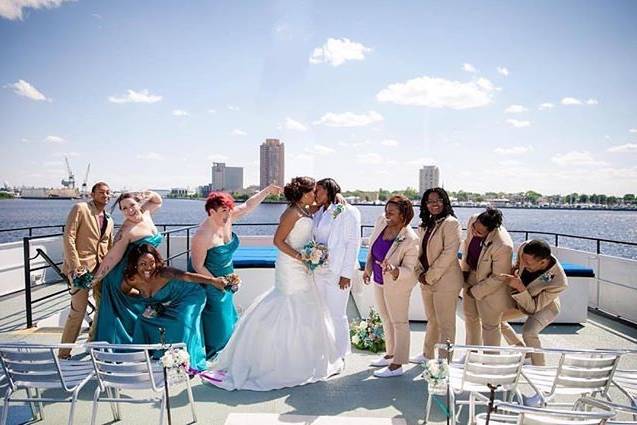 The newlyweds with the wedding attendants