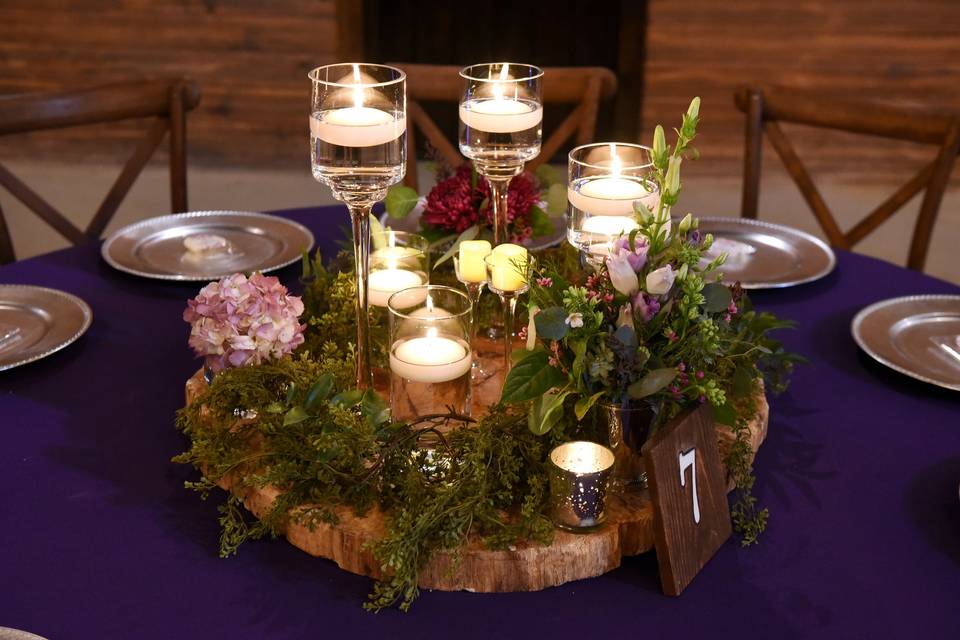 Pops of purple in centerpiece