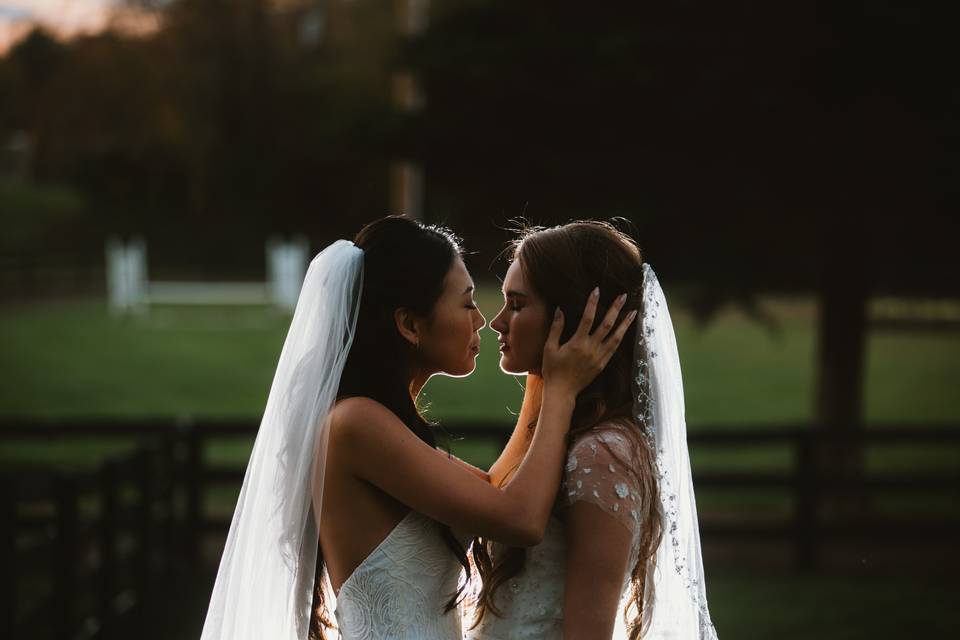 Brides about to kiss