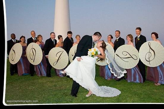 Add a touch of elegance to your wedding with our personalized parasols! We carry a variety of colors and sizes. Available with one or two initials that are hand-painted. Also available for purchase with no initials. Come by and see our selection:)
Bridesmaids holding their parasols with their personalized initials.