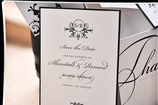 Quiet elegant distinguishes this Save the Date card. Jet black ink on shimmery white cardstock gives all the details so that guests can jot this date on their calendars. A custom monogram with the couples’ initials is dotted with a brilliant Swarovski crystal. The card is layered, white on black to create a fine edged border for subtlety.