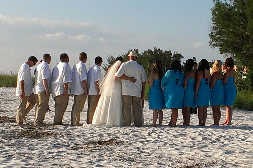 The couple with their groomsmen and bridesmaids