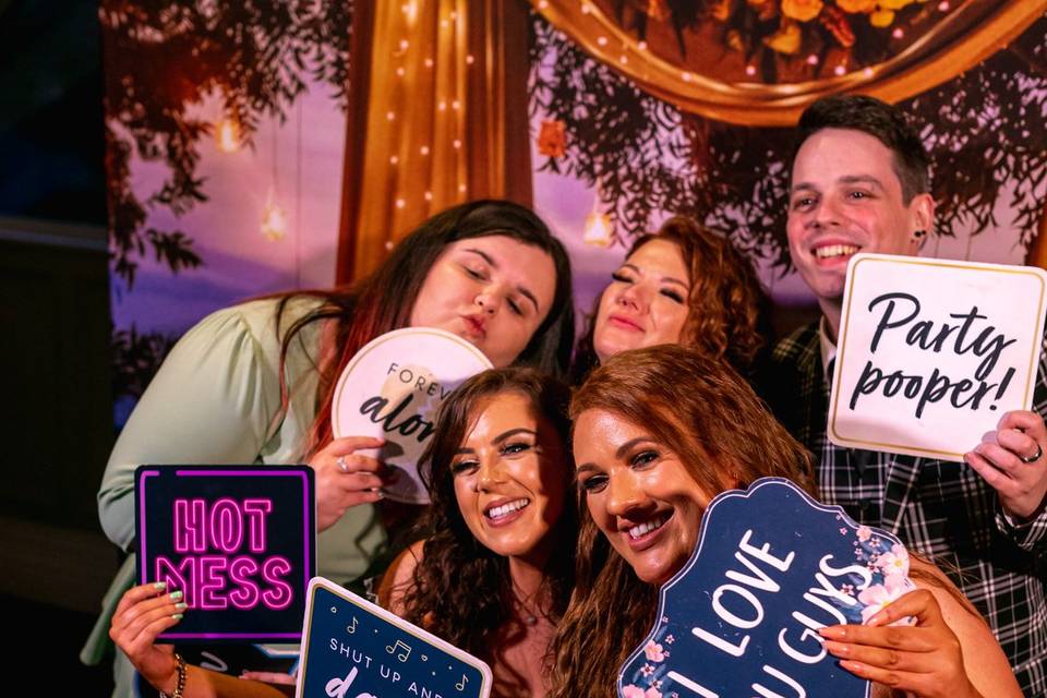 Guests using a photo booth