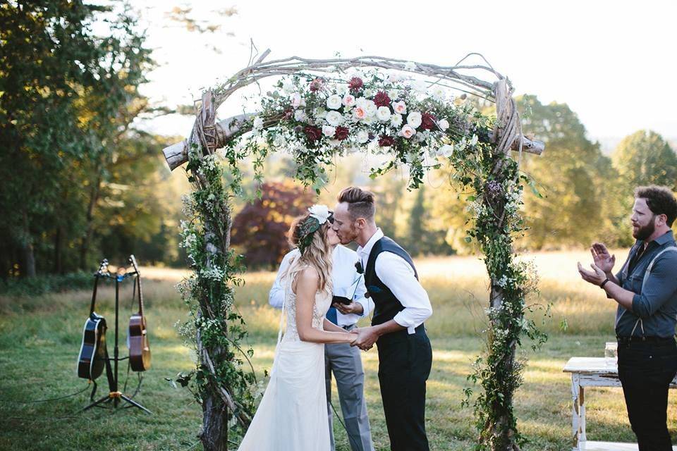 Newly wed couple sharing their first kiss