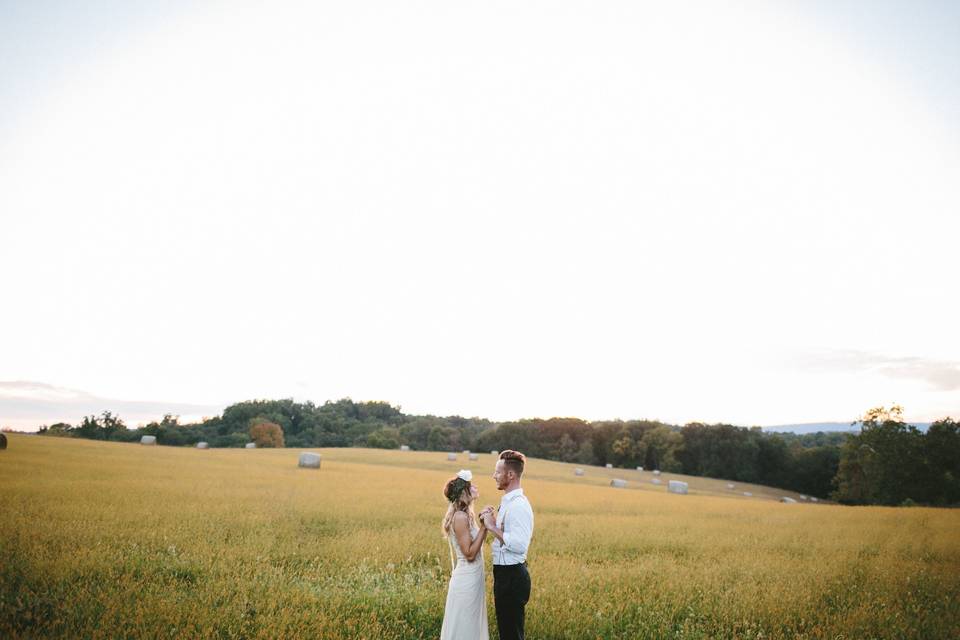 Couple by a wide open field