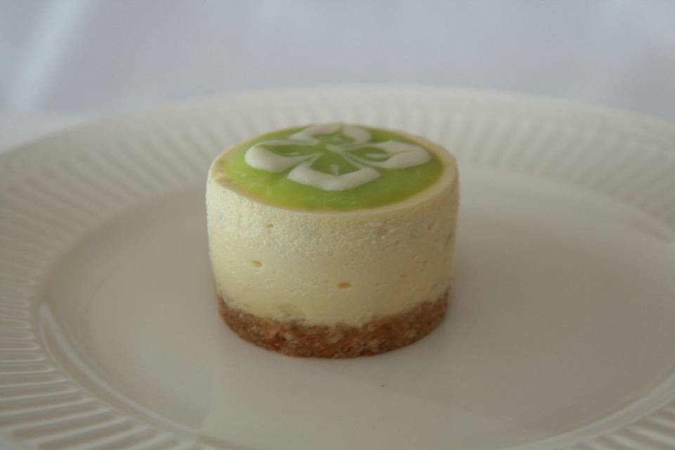 Key Lime Margarita Cheesecake - Creamy Key Lime Cheesecake, with a hint of Grand Marnier and Gold Tequila, topped with a key lime curd and finished with a sweet and salty pretzel crust