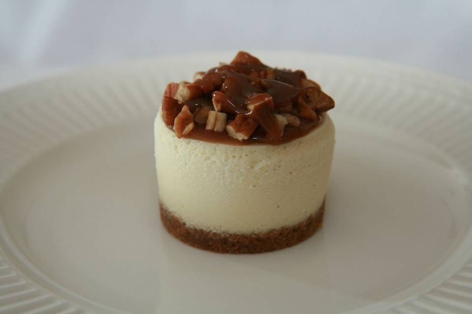 Original Turtle Cheesecake - Original Cheesecake, topped with a mound of pecans and caramel, finished with a traditional crust.