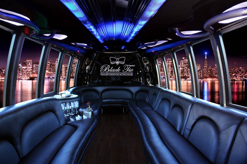 Limousine Bus is the ultimate vehicle for social events. Complete with fully stocked complimentary bar, ambient lighting, hard wood floors and leather wrap around seating. Seats up to 26 passengers.