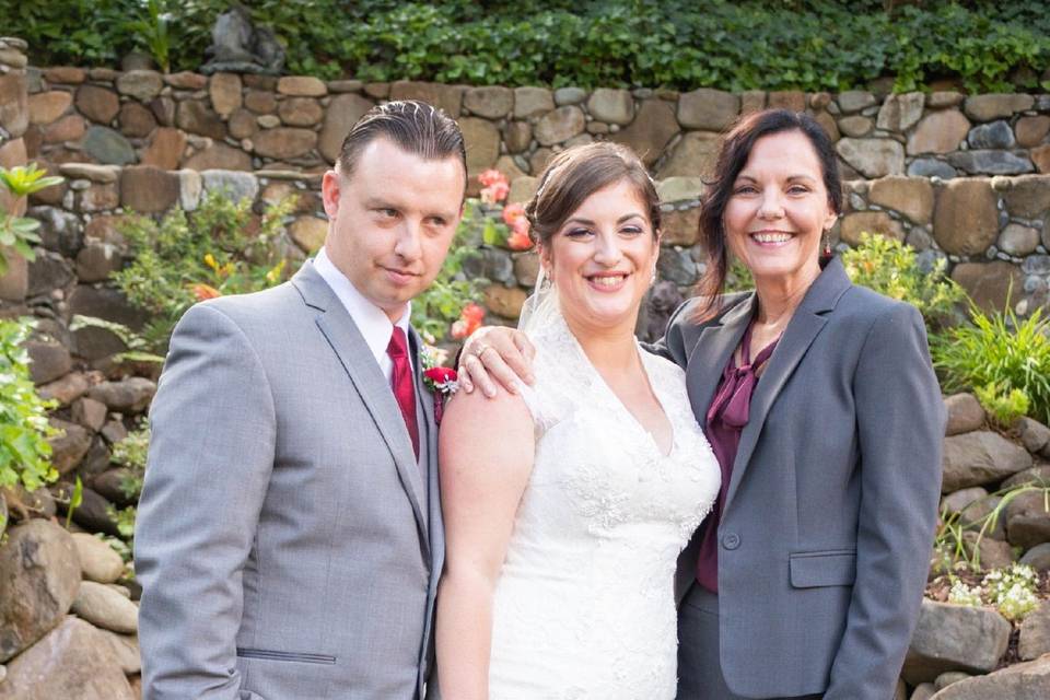 Newlyweds with the officiant