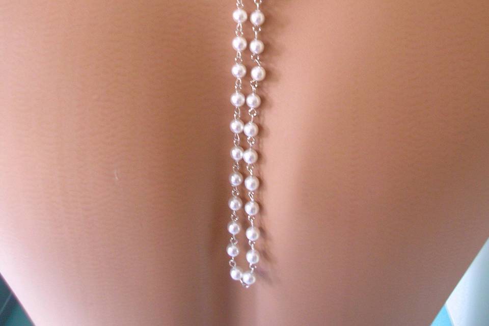 Custom made white pearl bridal backdrop necklace with ornate rhinestone front clasp by Crystalpearl on Etsy.
