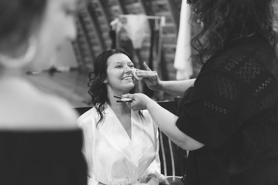 Getting her make up done.
