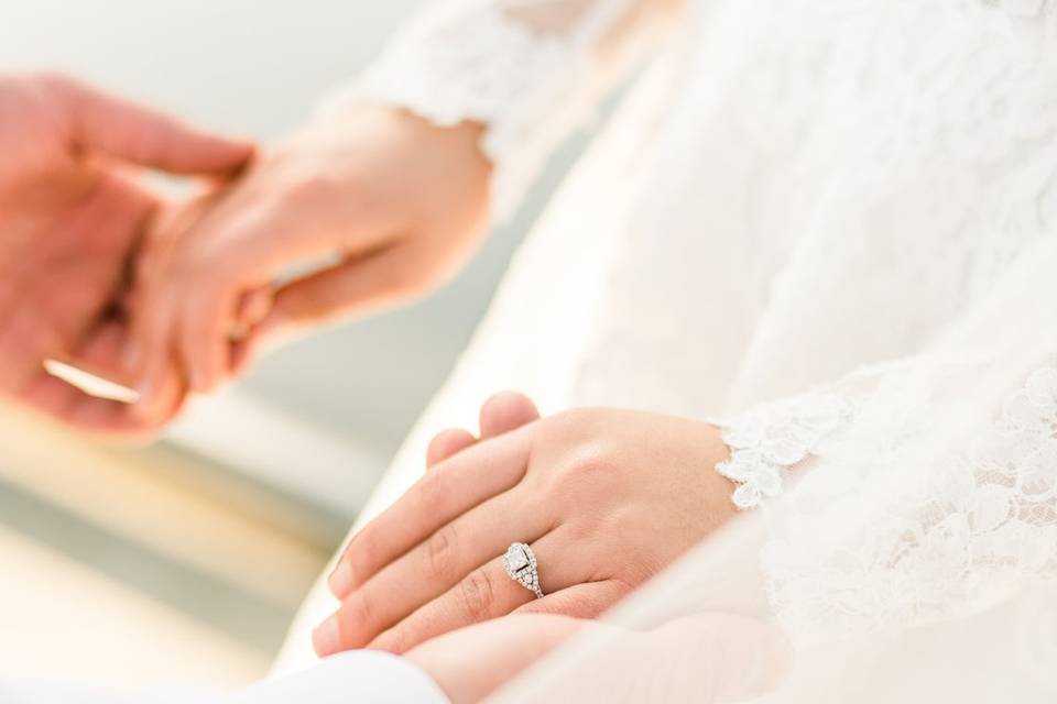 Holding hands and ring detail.