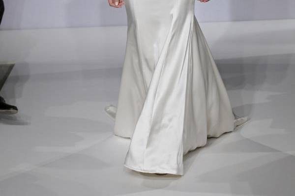 Mark Zunino MZBS1217
Beaded laser cut satin over illusion gown with cap sleeves, dropped waist bodice, and crepe back satin skirt - accented with satin covered French buttons