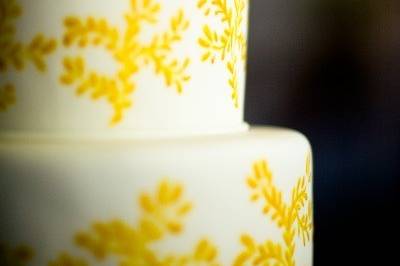 White cake with yellow design