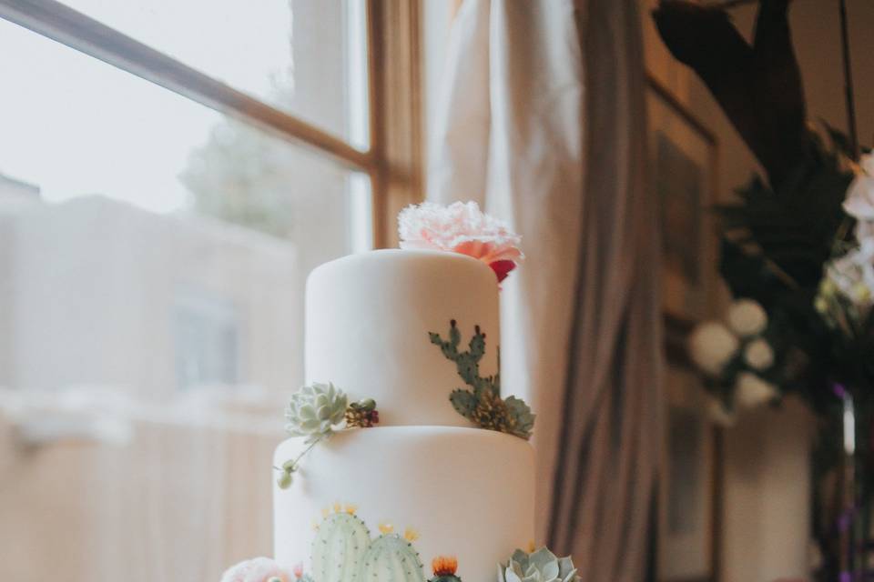 White cake with colorful flowers
