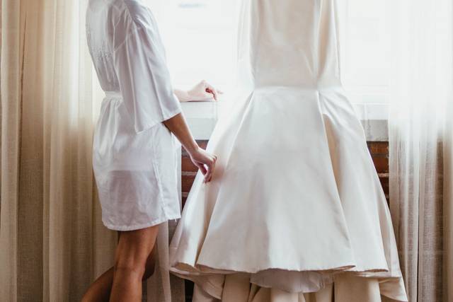 Bride examining her dress