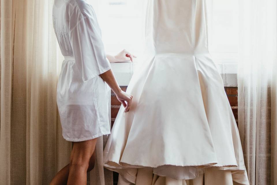 Bride examining her dress