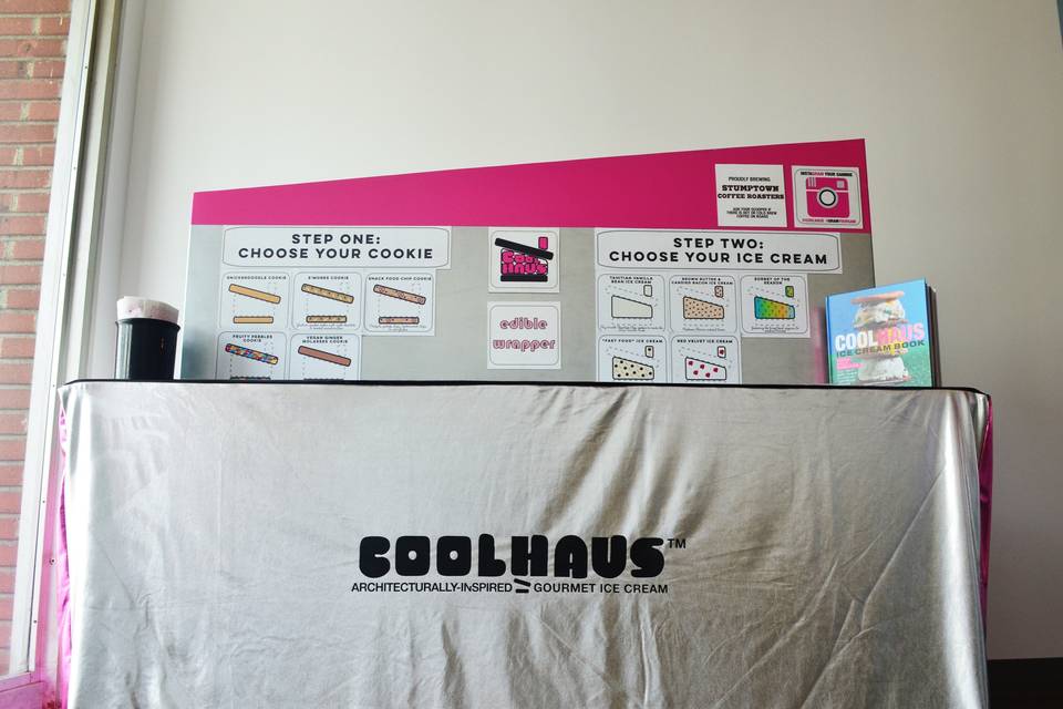 The Coolhaus pop-up bar set up was created to resemble our iconic ice cream truck. The table topper also hides the behind-the-scenes action that goes into making your guests' ice cream sandwiches. A plain tablecloth can also be used in order to blend in with your wedding theme.