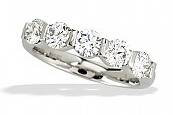 Round brilliant cut diamonds go half way around our 18k white gold or platinum wedding band