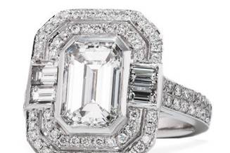 Engagement ring with an emerald cut center and baguette and micro pave detail.
Total Carat Weight: 2.40 center / 3.90 total