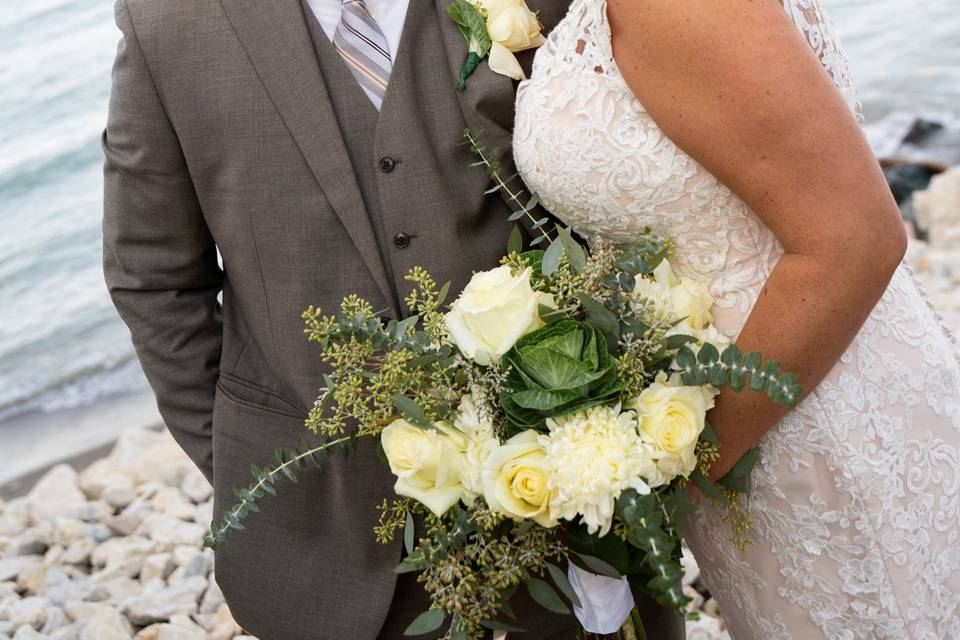 Bride and groom by water