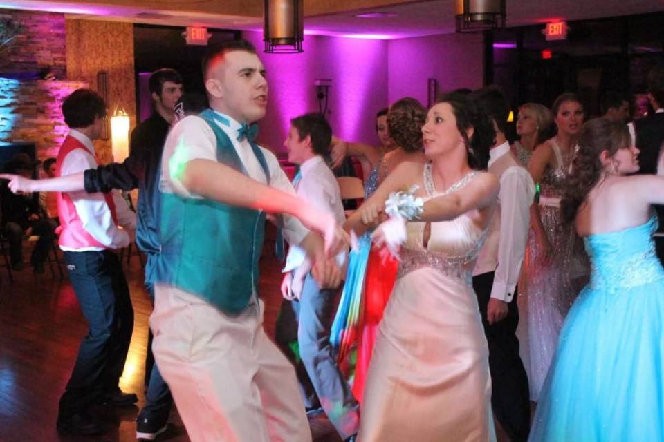 The couple and their guest dancing