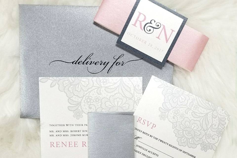 This is the wedding invitation package showing most of the pieces. It included the invite, RSVP, rehearsal dinner invitation (limited number), info card, addressed outer and inner envelopes and custom belly band.