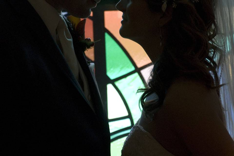 Kiss by stained glass