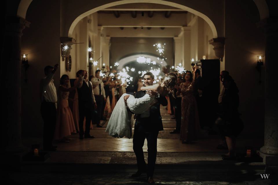 Newlyweds walking out the venue