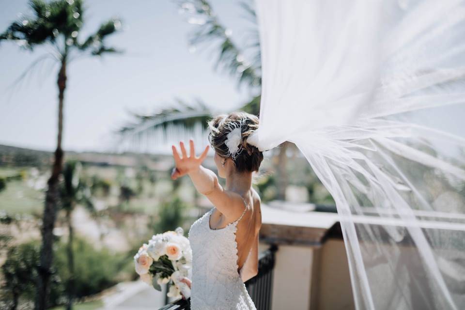 Bride flipping her veil