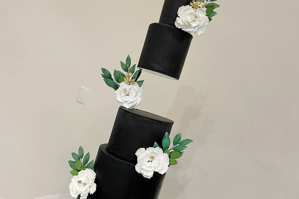 Black and greenery wedding cak