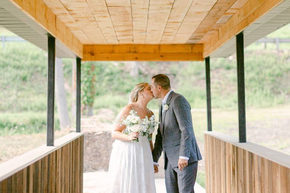 Bride and groom kissing