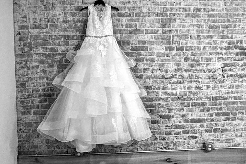 Gown hanging in bridal suite